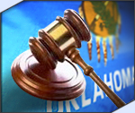 Photo of a gavel on an Oklahoma flag.